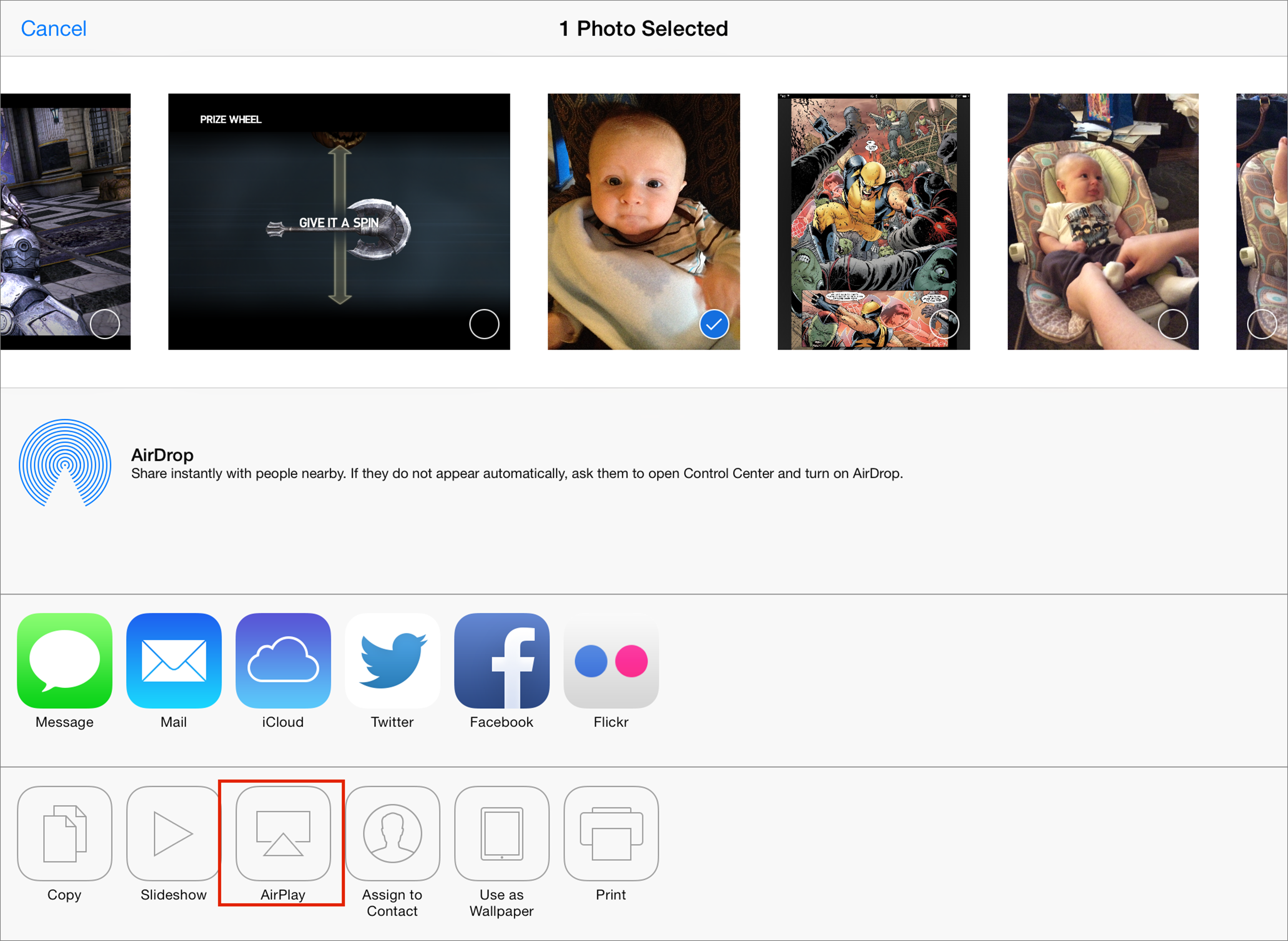 **Figure 91:** To AirPlay a photo in iOS 7, select it in the Photos app, tap the Share button, then tap the AirPlay button (shown here in the bottom row, with a red box drawn around it).