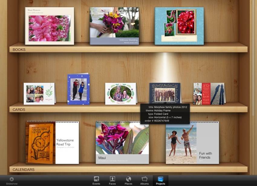 Once you’ve gotten a book, calendar, or card under your belt, Full Screen view reveals the world’s coolest project bookshelf.Click a project to see iPhoto illuminate it with a built-in shelf light. Point your cursor at a project to see its details.