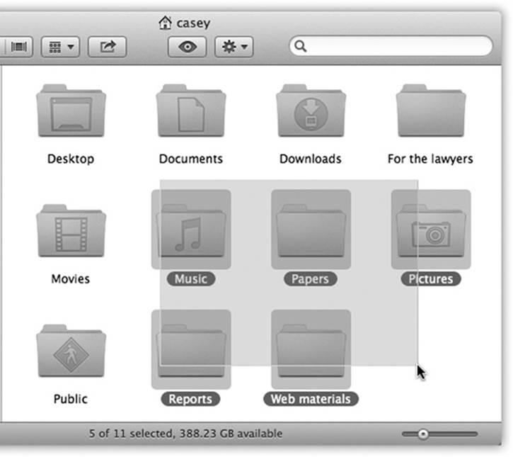 You can highlight several icons simultaneously by dragging a box around them. To do so, drag from outside the target icons diagonally across them, creating a translucent gray rectangle as you go. Any icons or icon names touched by this rectangle are selected when you release the mouse. If you press the Shift or ⌘ key as you do this, then any previously highlighted icons remain selected.