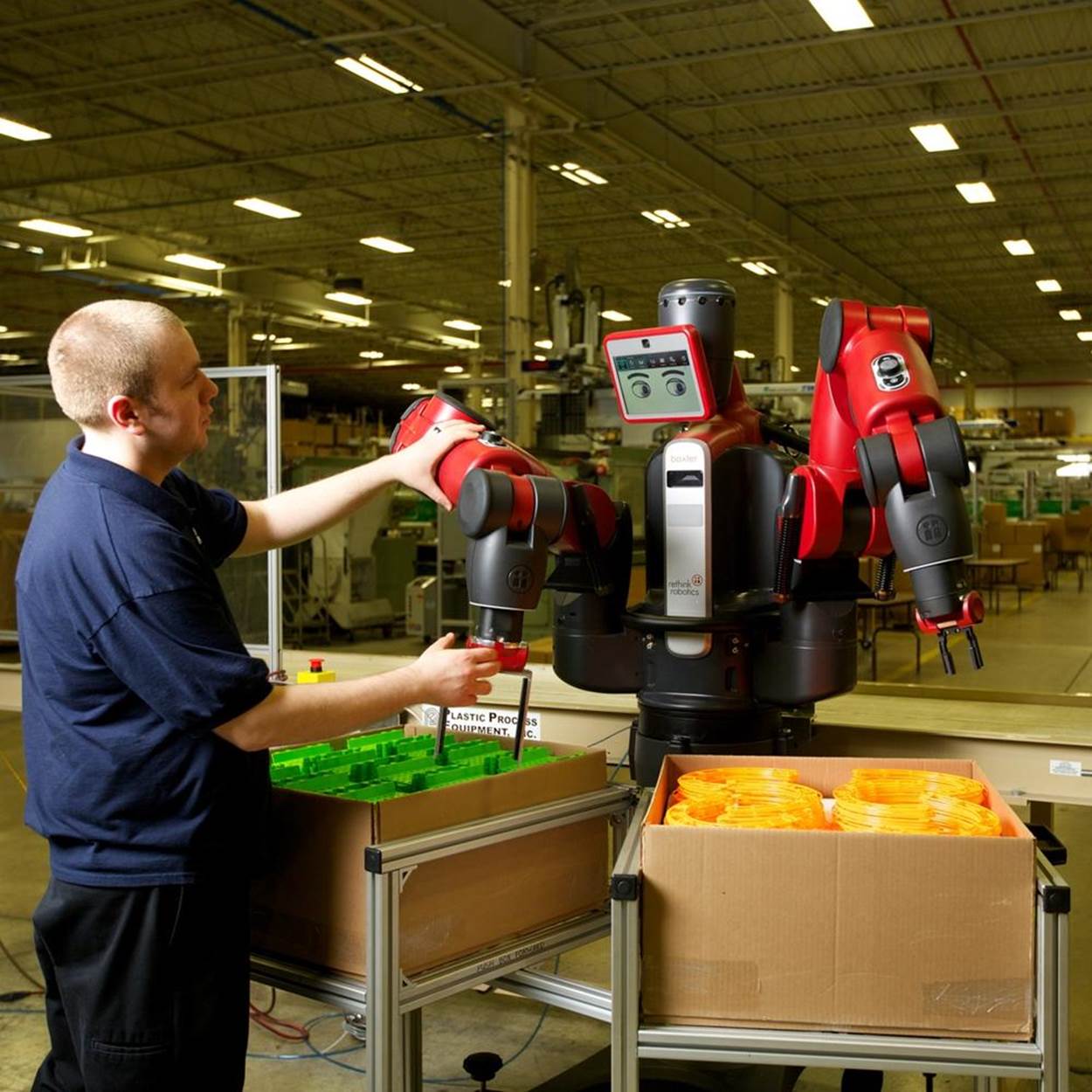 The Baxter industrial and research robot scales its movements to human speed, so it’s safer to work around. Credit: Rethink Robotics.