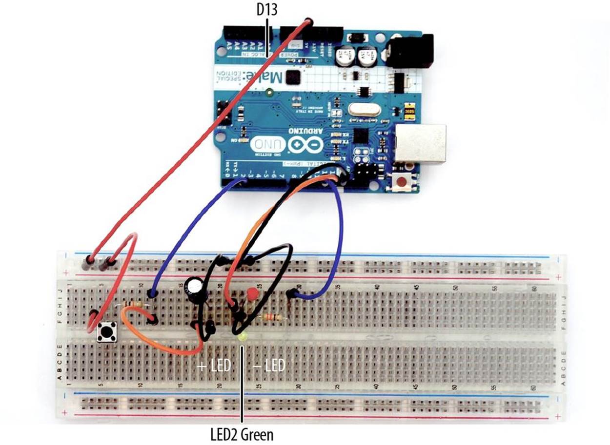 Adding a green LED indicator to the Trick Switch circuit built on a full-size clear breadboard