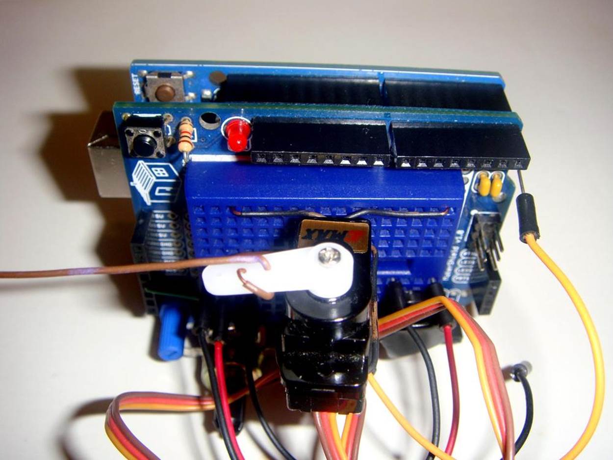 Servo motor attachment to breadboard: the free wire ends are inserted into the breadboard