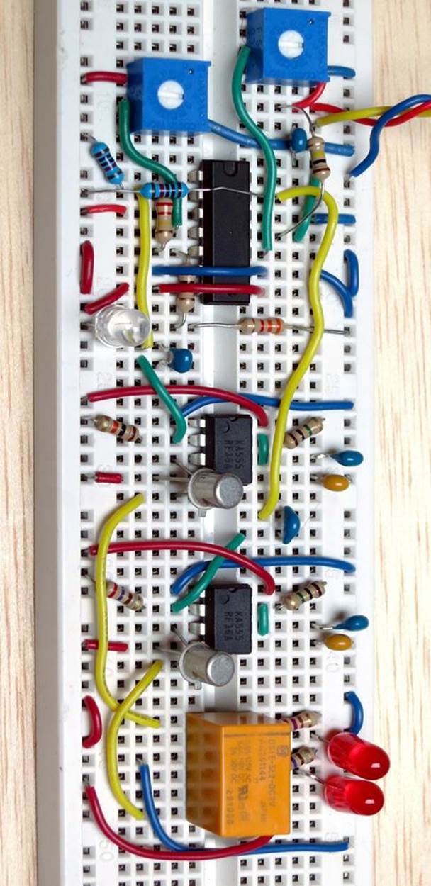 Breadboarded version of the final chronophotonic lamp switcher, omitting the alarm clock and the power supply that are necessary. The three colored wires disappearing off the edge of the photograph at top-right will be connected with the clock.