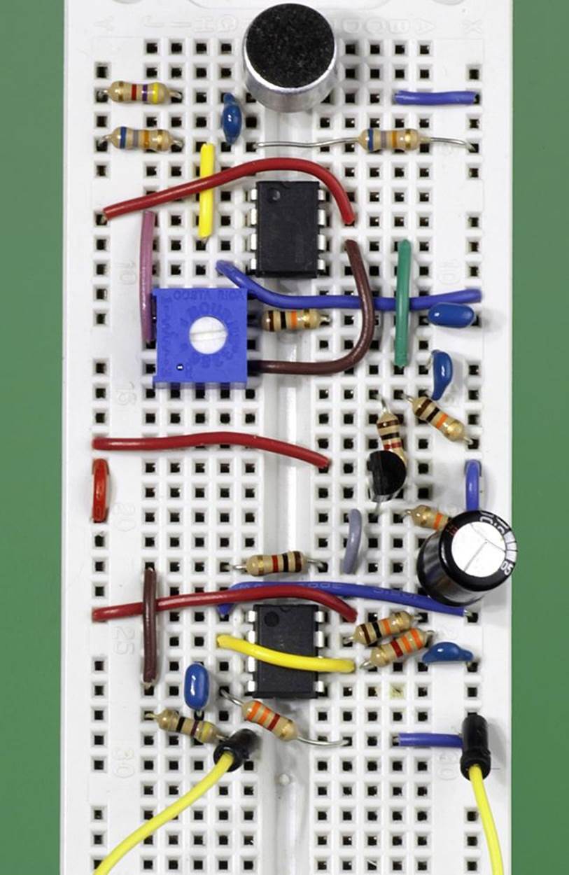 This breadboarded version of the Noise Protest Device circuit is designed to run from a 9V battery. The yellow wires at the bottom of the photograph are connected with a loudspeaker (not shown).