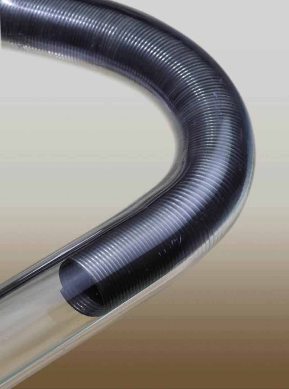 A piece of polethylene tube that has been bent into a smooth curve by inserting a spring before applying a heat gun.