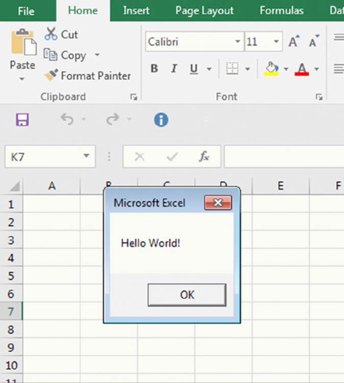 Screenshot shows the left end of the icons in home tab of an excel along with a pop up window showing hello world message and an OK button.