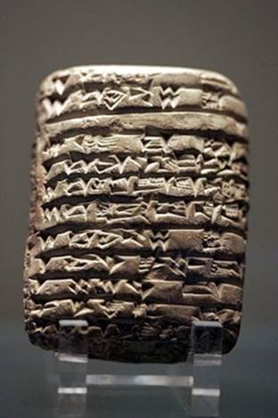 A cuneiform tablet listing a temple’s possessions (shown at the Louvre, <a href=