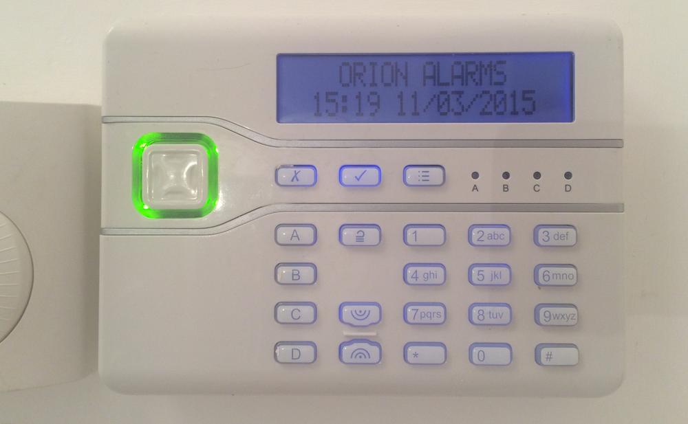 This alarm panel has a modal UI. In its default state, the numeric keypad is used to set/unset the alarm with codes. When the menu button is pressed, the numeric keys correspond to different items in nested menus (corresponding to functions such as setting zones, adding/removing users, viewing the system log and changing configuration settings). There are no cues on the device itself as to which number corresponds to which function, or which menus are available, so the user has to cycle through buttons to find the option they want. Labeled buttons would have made functions easier to find, but would have added many more buttons and increased the bill of materials.