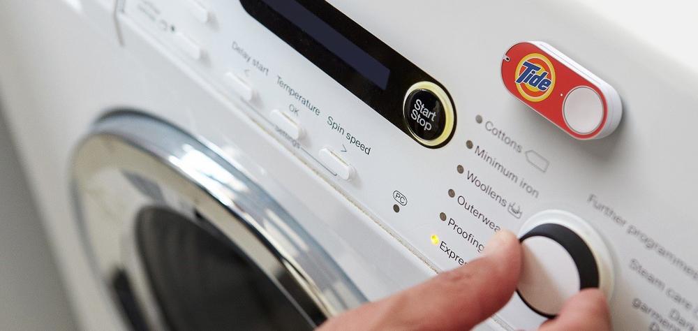An Amazon Dash button for ordering Tide laundry detergent on a washing machine (image: Amazon.com)