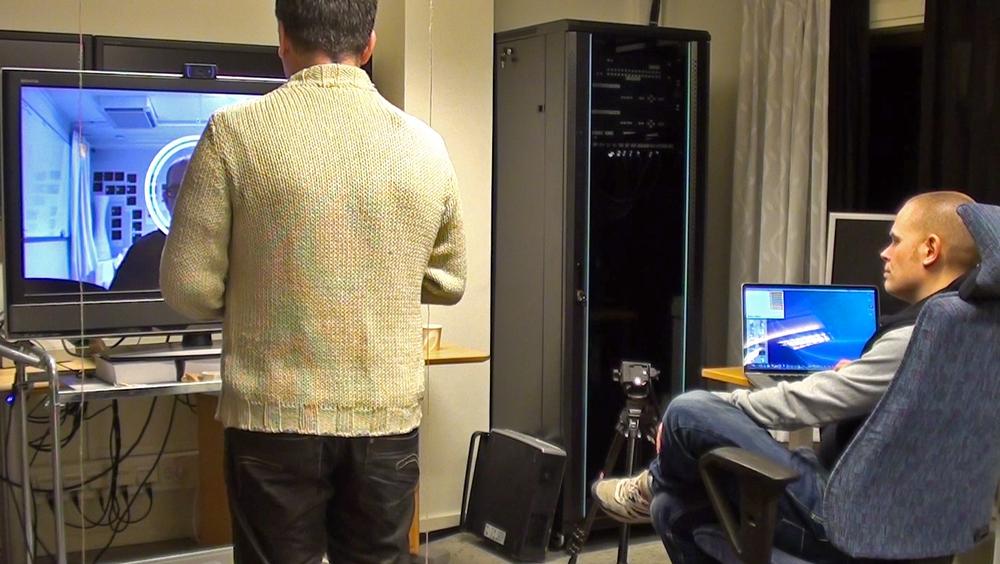 Behind the scenes of the Wizard-of-Oz prototype, the person at the laptop manually triggers animations as the demonstrator speaks (image: Ericsson User Experience Lab)